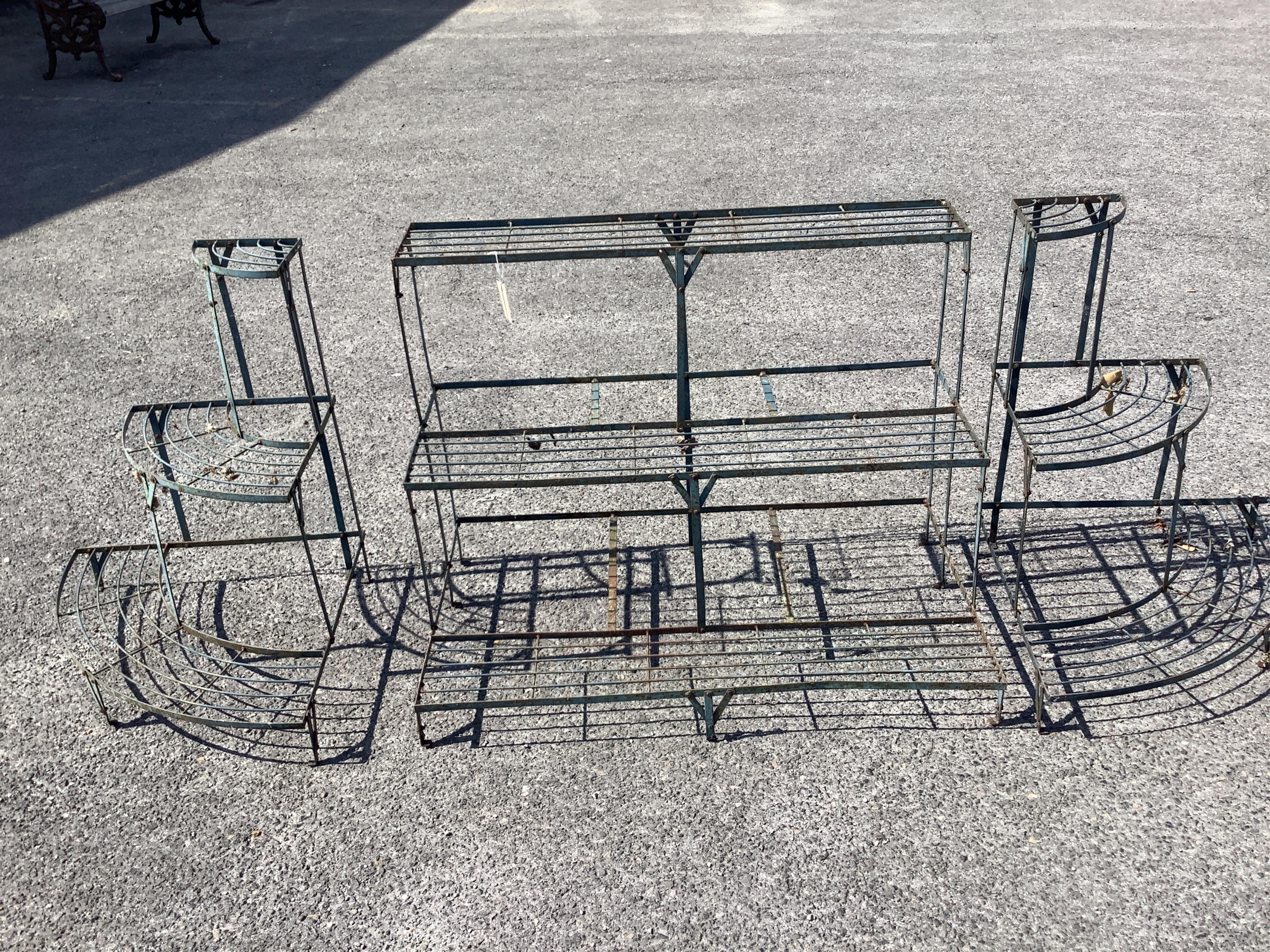 A Victorian style painted wrought iron three tier pot stand in three sections, combined length approximately 207cm, depth 57cm, height 75cm. Condition - fair
